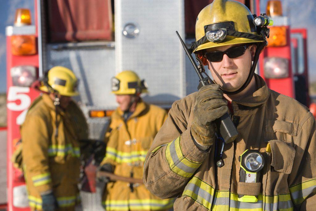 Firefighter using walkie talkie